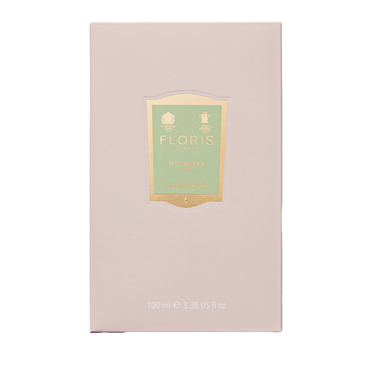 A light pink 100 ml box of Floris London Mulberry Fig Eau de Parfum features a gold-green label and a soft floral amber fragrance.