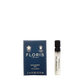 A small blue Floris London Mulberry Fig-Eau de Parfum box sits next to a 2 ml sample, featuring a floral amber and woody scent.