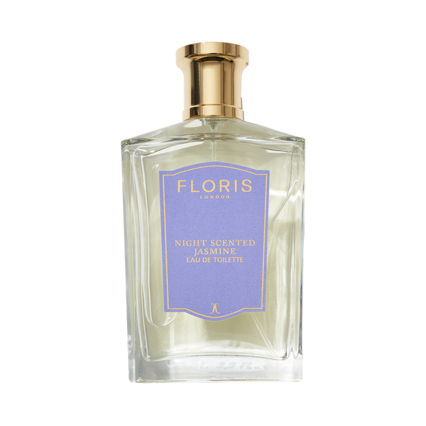 A clear glass bottle of Floris London Night Scented Jasmine Eau de Toilette, with a gold cap and purple label, blending neroli blossom and white jasmine.