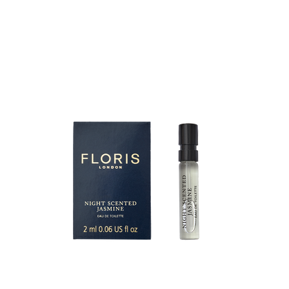 A 2 ml Night Scented Jasmine - Eau de Toilette vial by Floris London rests by its navy and gold box, evoking white jasmine and Mediterranean blooms.