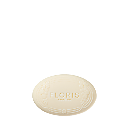 Oval bar of Night Scented Jasmine Luxury Soap by Floris London, vegetable-based with embossed logo and floral border on a white background.