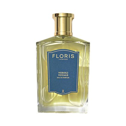 A clear glass bottle of Floris London Neroli Voyage - Eau de Parfum with a gold cap and blue label sits against a white background.