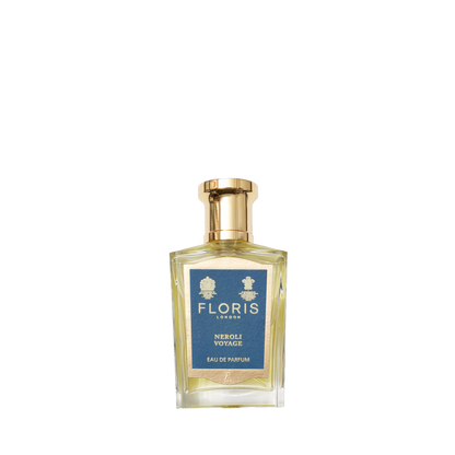 A clear glass bottle of Floris London Neroli Voyage - Eau de Parfum, with a gold cap and blue label, is shown against a white background.
