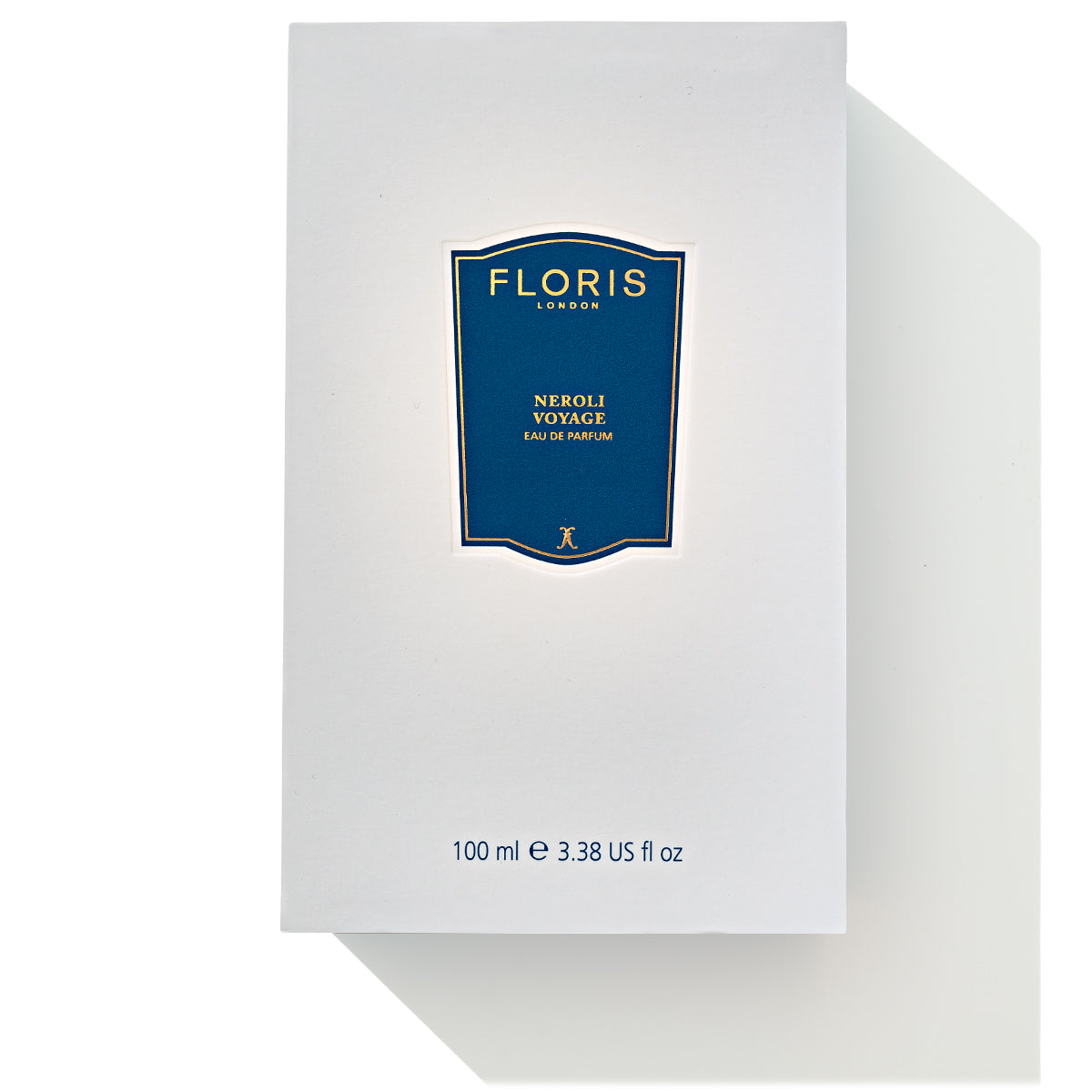 A white Floris London box adorned with a blue label reads "Neroli Voyage - Eau de Parfum." Beneath the label, it states "100 ml e 3.38 US fl oz." This unisex fragrance blends a citrus marine essence, making it perfect for any occasion.