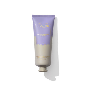 A tube of Floris London EU Night Scented Jasmine Hand Treatment Cream, featuring a violet cap and a light purple and beige gradient on the body. Ideal for very dry hands, this exquisite hand treatment offers rich nourishment and care.