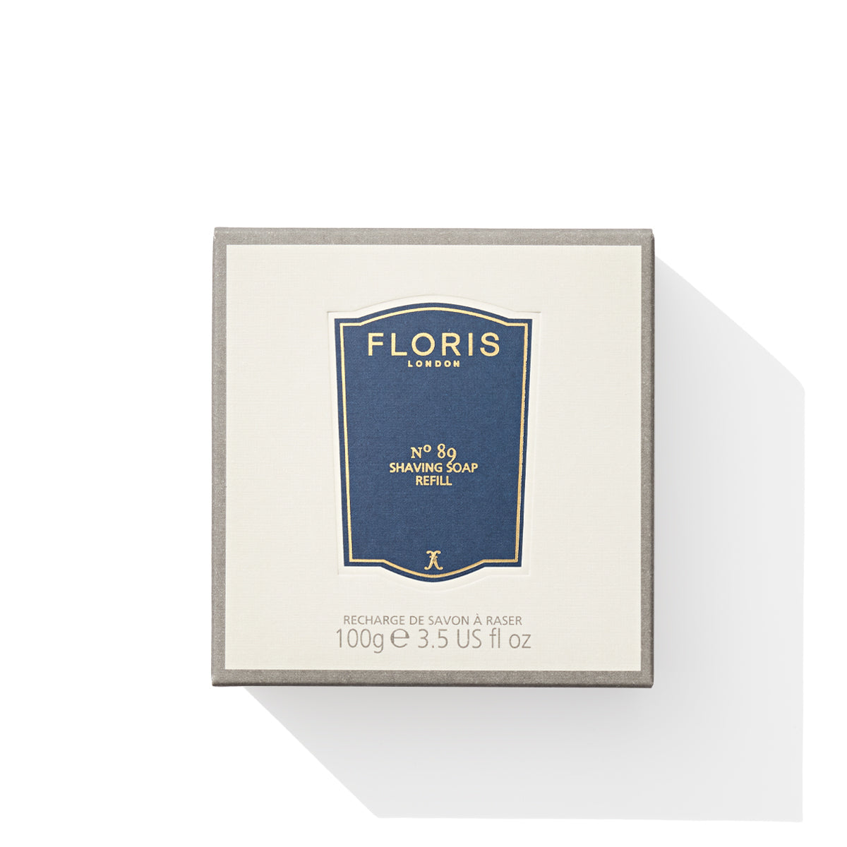 The No. 89 - Shaving Soap Refill by Floris London comes in a creamy package adorned with a blue label and weighs 100g (3.5 US fl oz). Infused with sandalwood, it provides a luxurious and aromatic shaving experience.