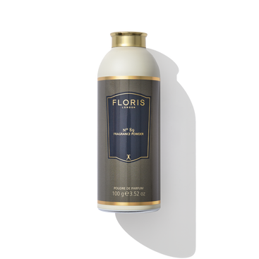 A bottle of No. 89 - Fragrance Powder by Floris London EU, the finest fragrance powder, contains 100 grams (3.52 oz) of product, with a dark grey label and gold cap. Enriched with aloe vera to soothe and protect skin.