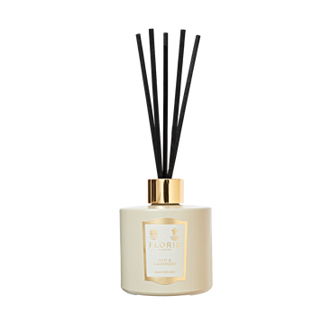 The Floris London Oud & Cashmere Reed Diffuser features six black reeds and a gold label, adding luxurious fragrance to any room.