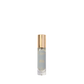 A small glass bottle of Floris London Purple Mémoire Eau de Parfum with a gold cap, displayed upright against a plain white background.