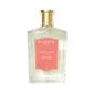 A clear glass bottle of Floris London EU Red Rose with a gold cap and pink label, showcasing the enduring scent of Rose Absolute.