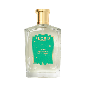A clear glass bottle of Floris London EU’s Rose Geranium | Limited Edition Eau de Parfum with a green label and gold cap, on a white background.