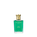 A green glass bottle of Floris London Rose Geranium - Bath Essence, rich in concentrated fragrance, rests on a simple white background.