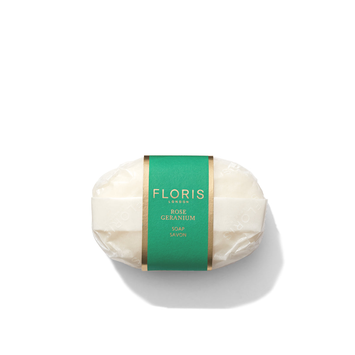 A bar of Floris London EU Rose Geranium Soap wrapped in white paper with a green and gold label on a white background.