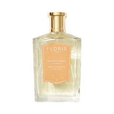 A clear glass bottle of Floris London EU Sandalwood Eau de Parfum with a gold cap is shown against a white background.