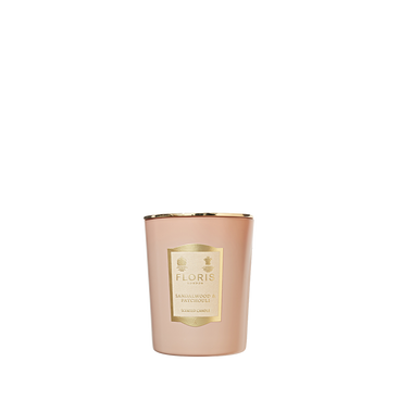 A Floris London Sandalwood & Patchouli candle with a gold label is displayed against a plain white background.