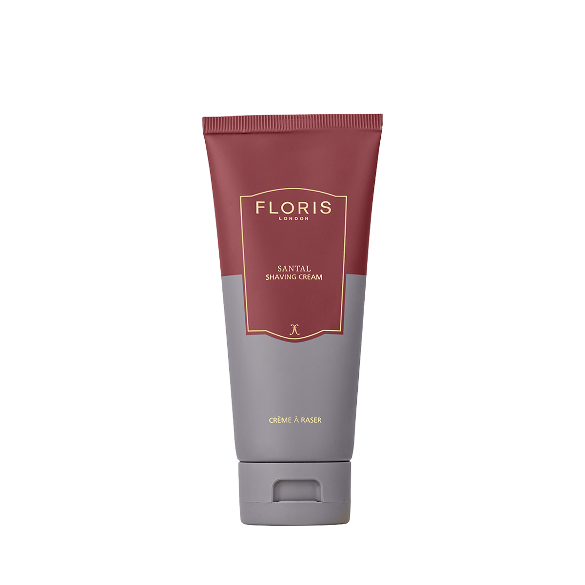 A tube of Floris London UK Santal Shaving Cream stands upright against a plain white background, featuring maroon and gray packaging for sensitive skin.