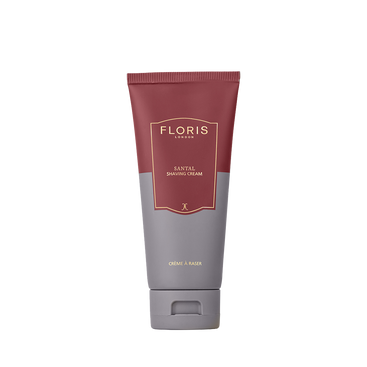 A tube of Floris London UK Santal Shaving Cream stands upright against a plain white background, featuring maroon and gray packaging for sensitive skin.