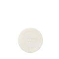 Santal Shaving Soap Refill by Floris London—round, white, nourishing shea butter soap embossed "FLORIS LONDON SHAVING SOAP" on top.