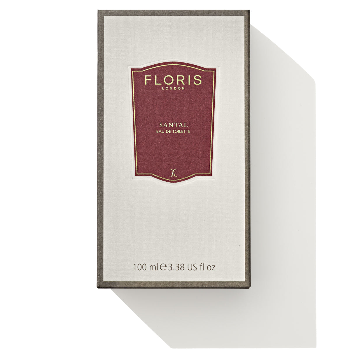 A rectangular box of Floris London Santal - Eau de Toilette, 100 ml (3.38 US fl oz). The box is brown with a white center, featuring the brand and product name. This refined men's fragrance showcases the rich aroma of sandalwood.