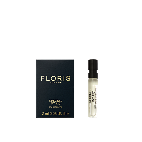 Floris London's Special No. 127 Eau de Toilette, in a 2ml spray, with bergamot and lavender hints, embodies historic elegance beside its dark blue box.
