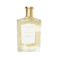 A clear glass bottle of Floris London EU Stephanotis perfume with a gold cap, white label, and light yellow floral fragrance inside.