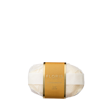 Stephanotis Soap by Floris London EU: a white, finely milled fragranced soap in clear plastic with a gold label and white band, on a plain background.