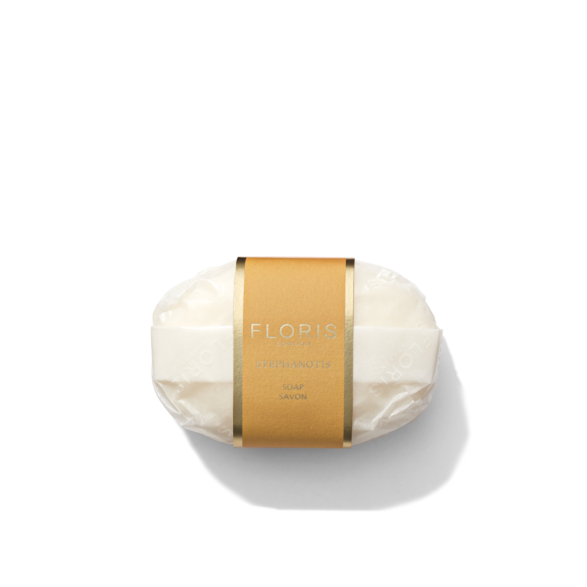 A bar of Stephanotis Soap by Floris London EU, wrapped in clear plastic with a brown and gold label around the center, placed against a white background.