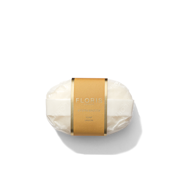 A bar of Stephanotis Soap by Floris London EU, wrapped in clear plastic with a brown and gold label around the center, placed against a white background.