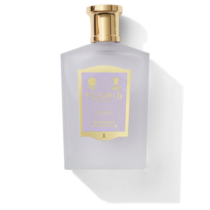 A bottle of Floris London "Violet - Mouthwash" adds a touch of elegance to your oral care routine. The light purple bottle features a gold-colored cap and label, enhancing its sophisticated appeal. This fluoride-free mouthwash boasts anti-bacterial properties, ensuring elevated hygiene with every use.