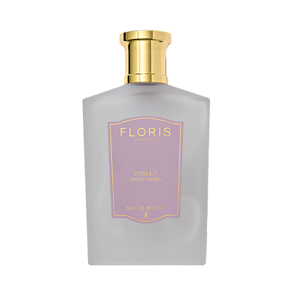 A frosted bottle of Floris London Violet - Mouthwash with a gold cap and lavender-gold label offers an ultimate touch of luxury to your routine.