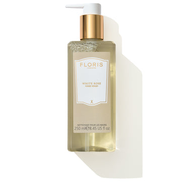 A clear bottle of Floris London EU White Rose - Hand Wash, featuring a gold pump dispenser, contains 250 ml (8.45 US fl oz) of mild hand wash with the delicate scent of White Rose.