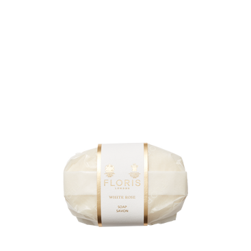 A Floris London EU White Rose Soap bar with shea butter, wrapped in translucent paper with a gold label, set against a plain white background.
