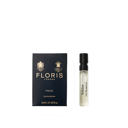 A 2ml sample of Floris London EU Wilde - Eau de Parfum sits next to its dark blue box with gold lettering on a plain white background.