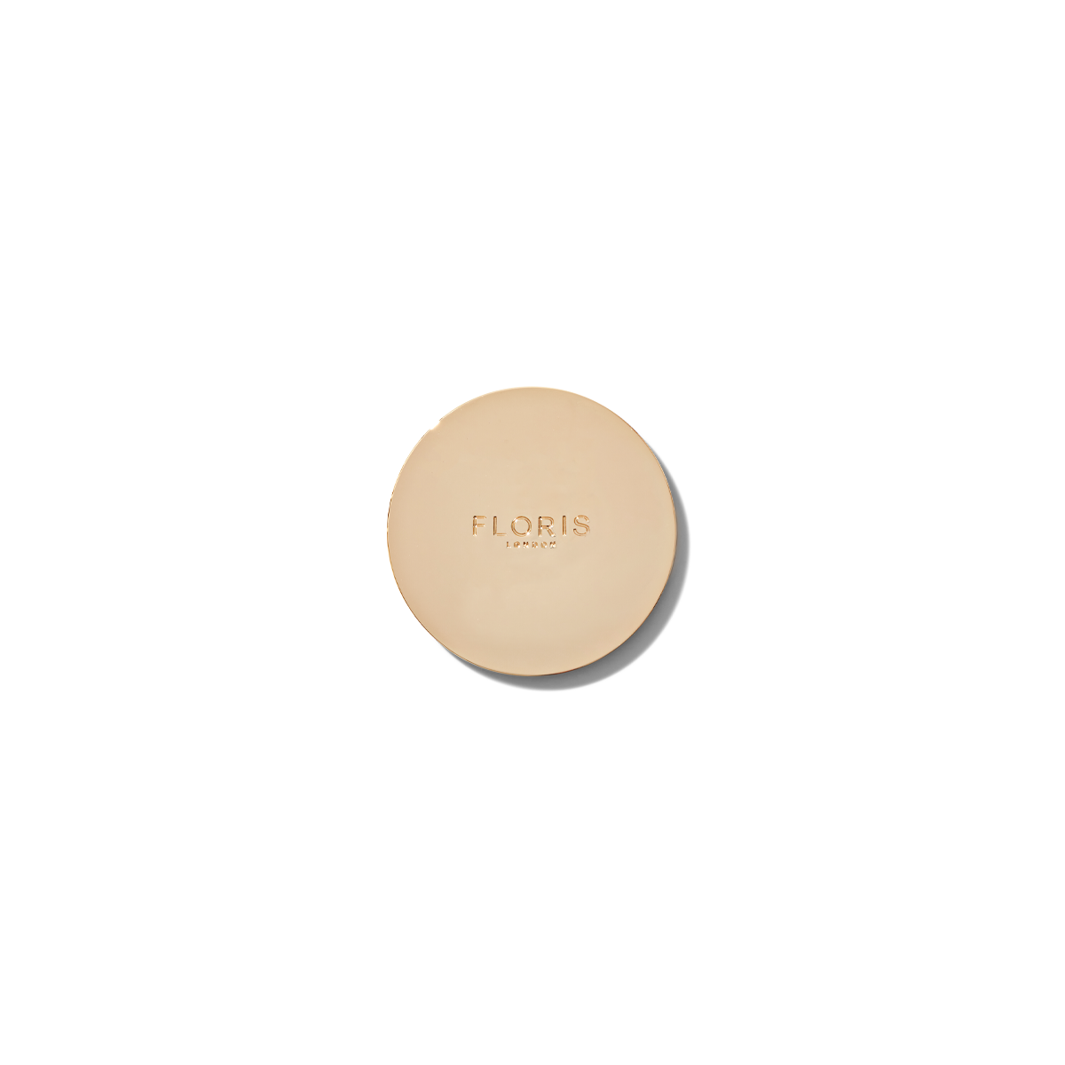 Floris london gold candle lid embossed with Floris london.
