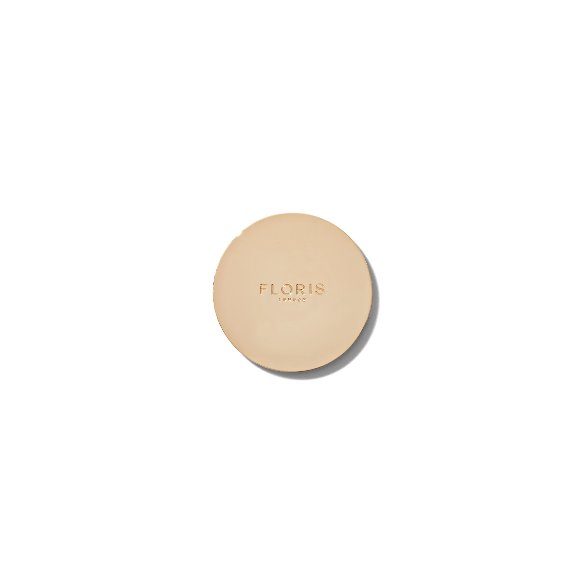 Gold candle lid embossed with Floris London.