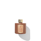 Burnt orange reed diffuser bottle for the cinnamon and tangerine fragrance.