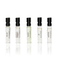 Five mini glass vials with black writing containing Jermyn Street Collection 