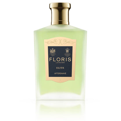 Frosted glass bottle with gold cap containing Floris London elite aftershave.