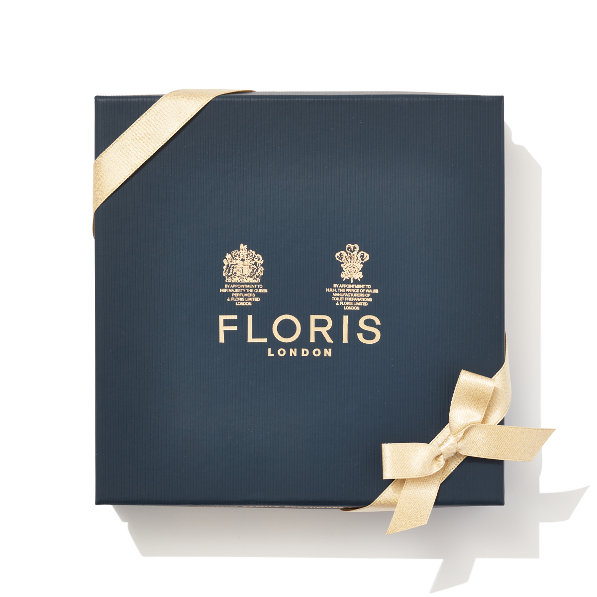 Large navy gift box with gold ribbon and gold label containing the Luxury Soap Collection,