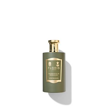 Jungle green bottle with gold cap containing grapefruit and rosemary room fragrance.