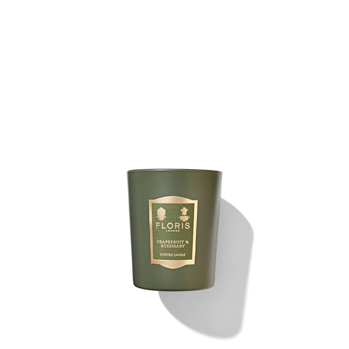 Jungle green candle with gold rimmed green label reading 'Floris london grapefruit and rosemary scented candle.