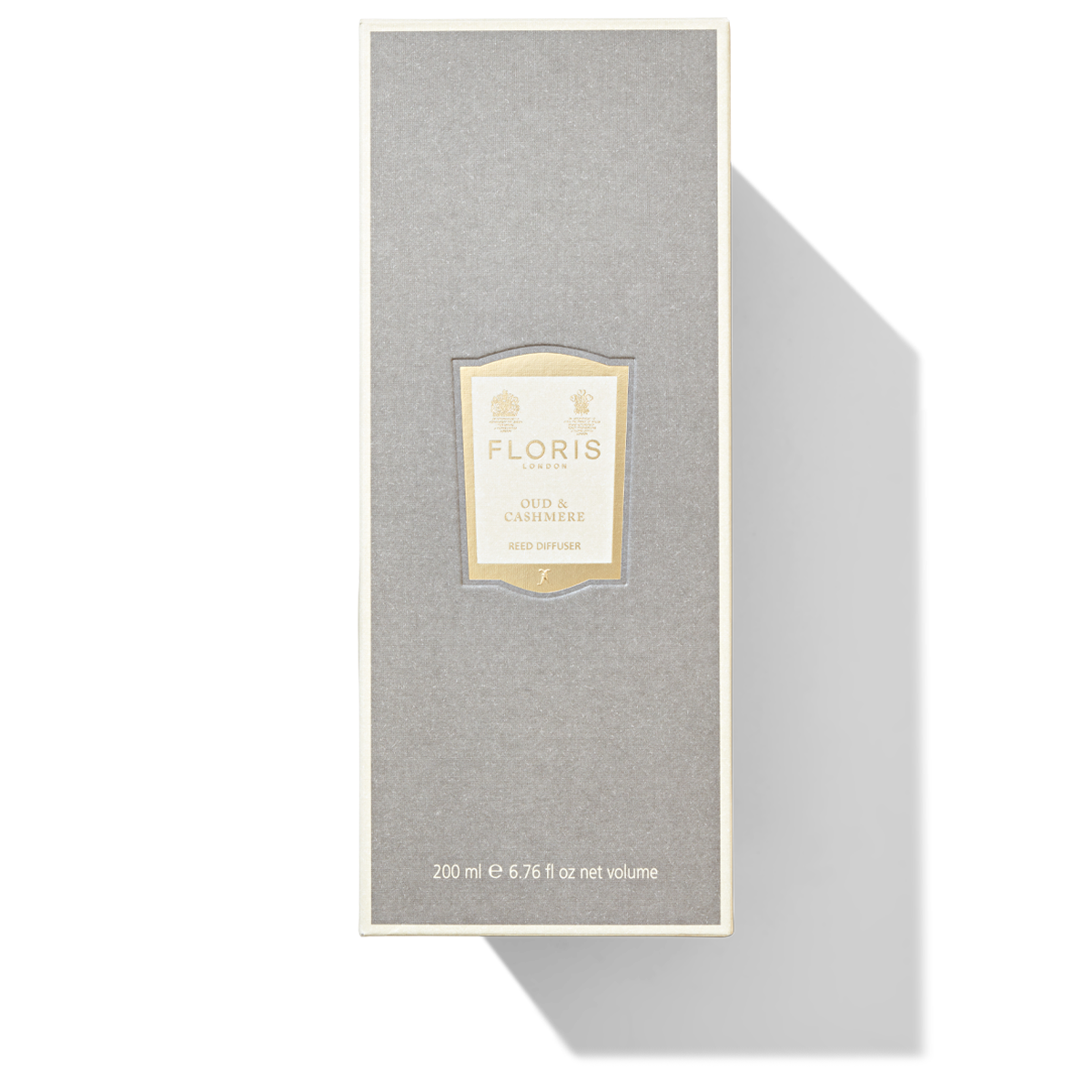 Large, tall grey box with a cream and gold label containing the Oud & Cashmere Reed Diffuser