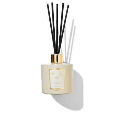 Oud & Cashmere Reed Diffuser in a beige coloured jar with a cream and gold label, shiny gold cap and 5 black reeds. 