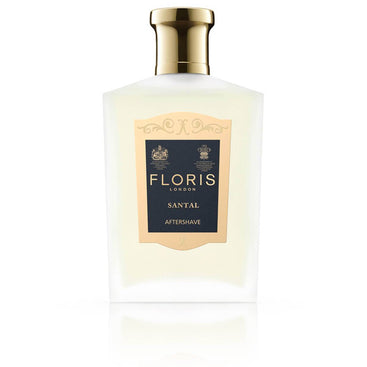 Frosted bottle with a gold cap, including a navy blue and gold label for the Floris london santal aftershave.