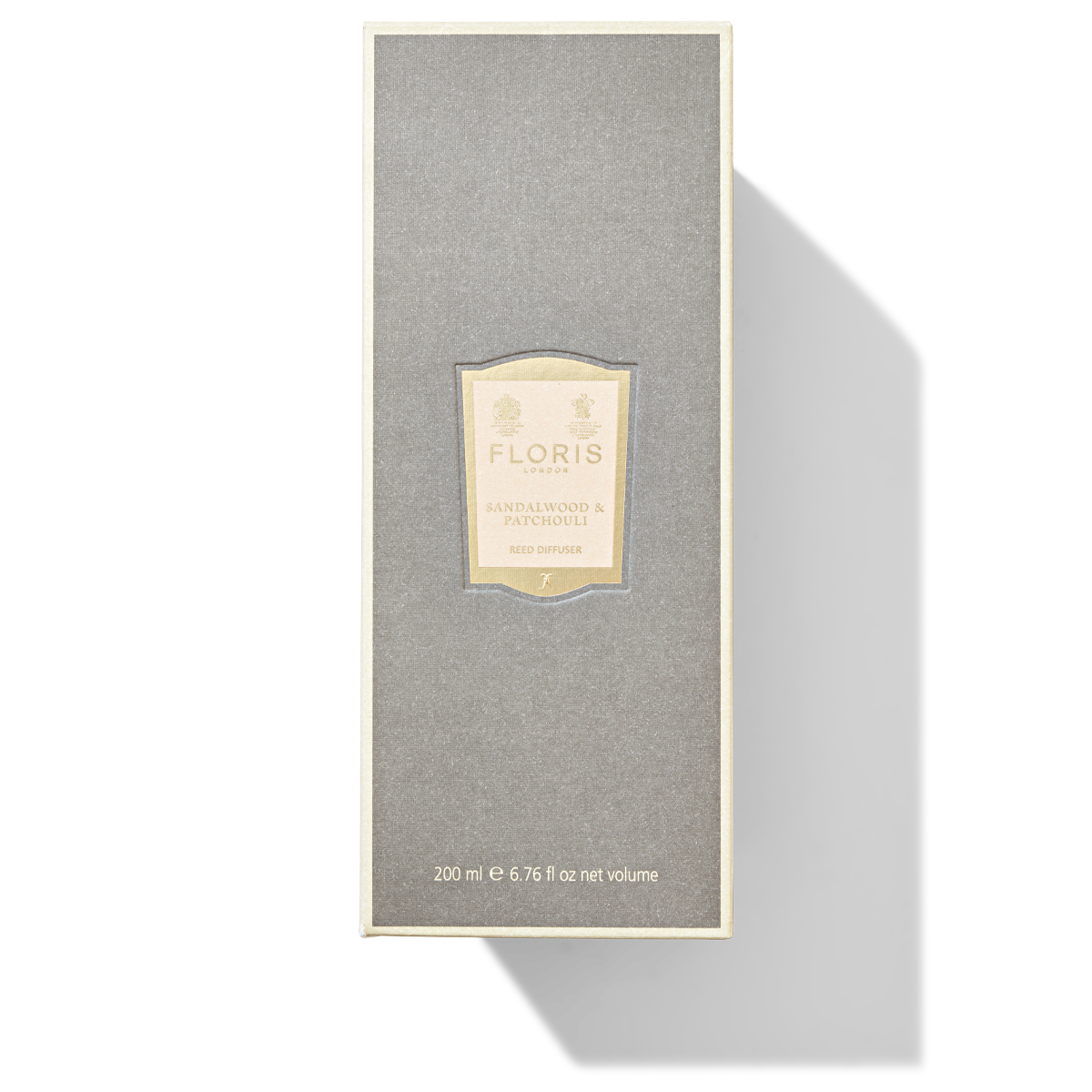 A grey mushroom coloured packaging box for the sandalwood and patchouli reed diffuser.