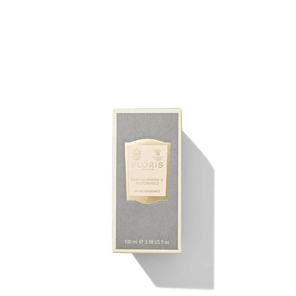 A grey mushroom coloured packaging box for the sandalwood and patchouli room fragrance.