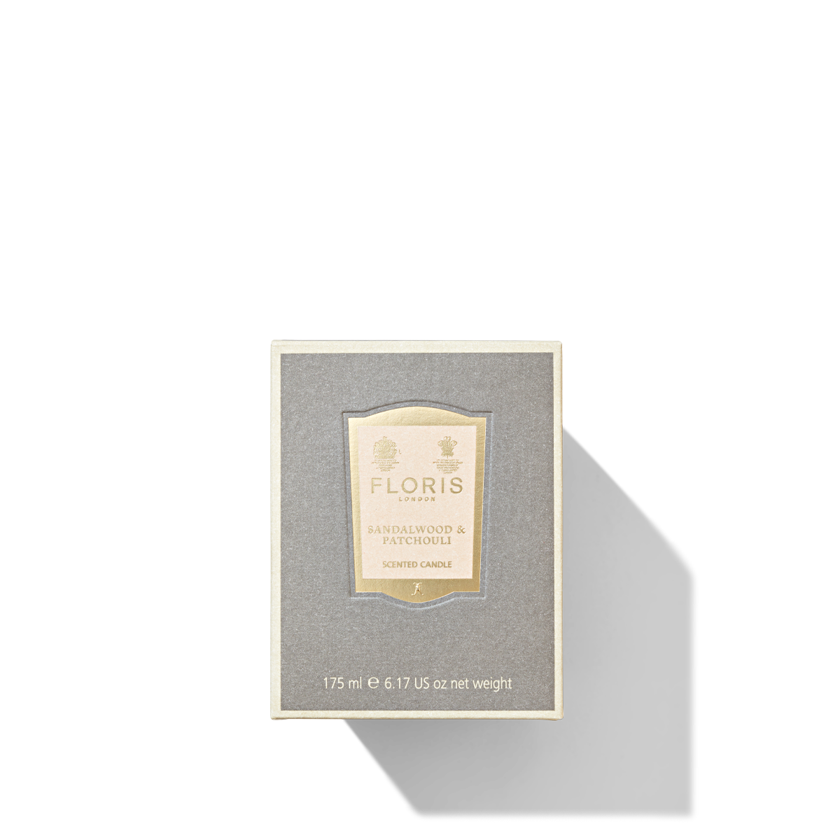 Grey mushroom coloured bod with light pink and gold label reading 'Floris london sandalwood and patchouli scented candle'.
