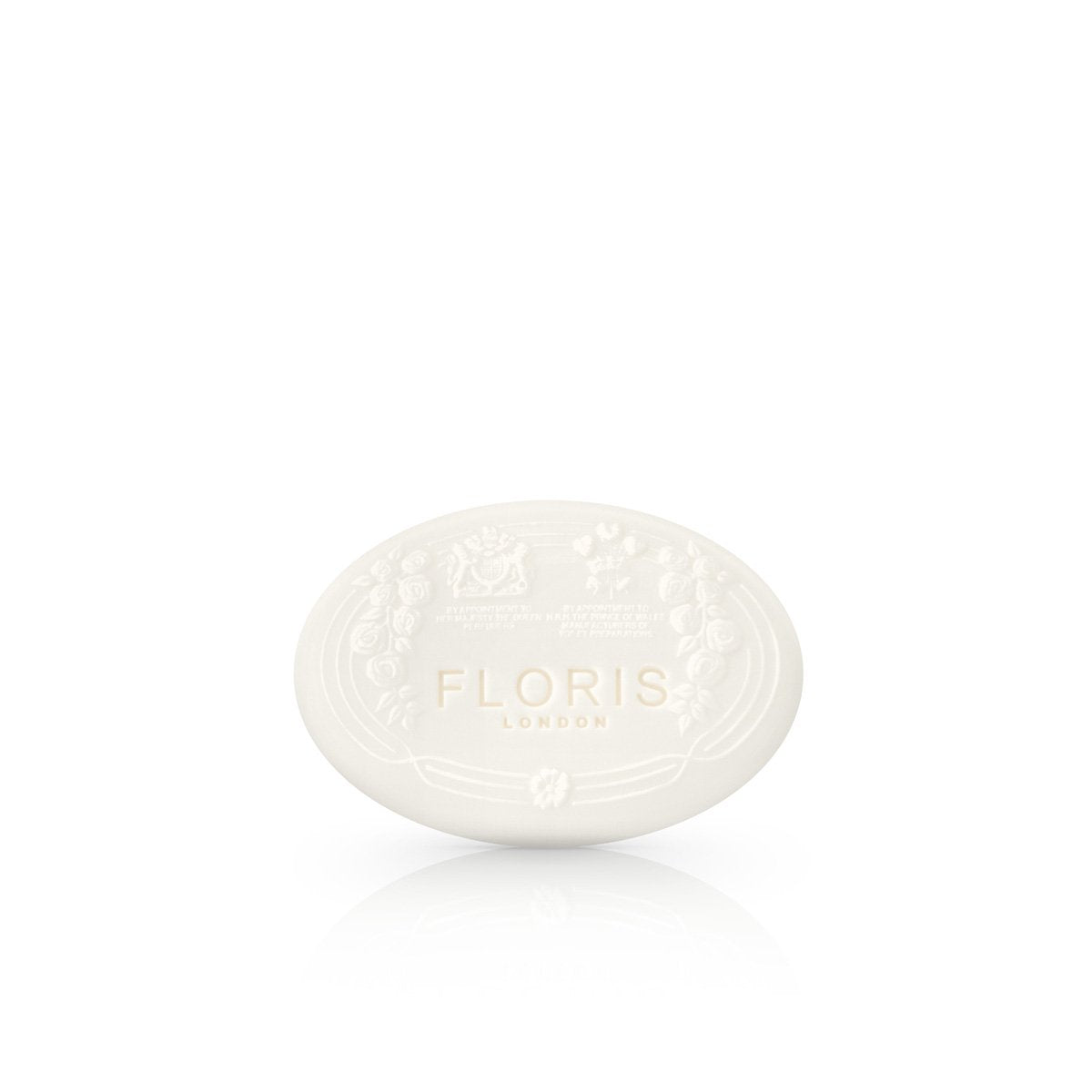 A white oval shaped soap embossed with Floris london and flower decorations in the elite scent.
